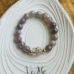 Elegant Gray Bracelet with Gold Beads